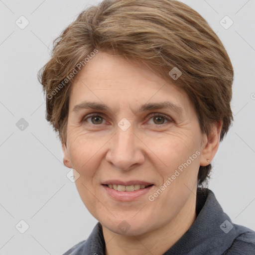 Joyful white adult female with short  brown hair and brown eyes