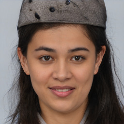 Joyful asian young-adult female with long  brown hair and brown eyes