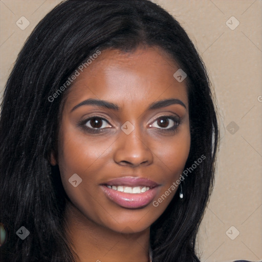 Joyful black young-adult female with long  brown hair and brown eyes