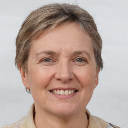 Joyful white adult female with short  brown hair and grey eyes