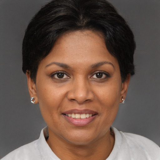 Joyful white adult female with short  brown hair and brown eyes