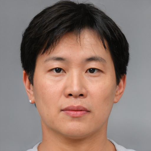 Neutral asian young-adult male with short  brown hair and brown eyes