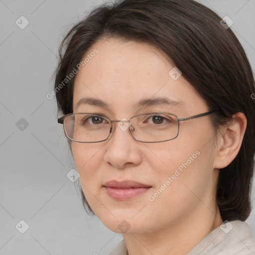 Joyful white adult female with medium  brown hair and brown eyes