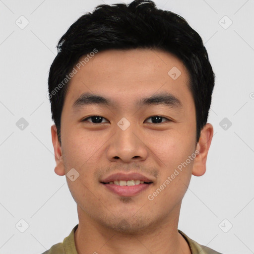 Joyful asian young-adult male with short  black hair and brown eyes