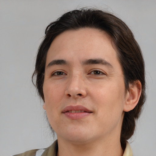 Joyful white young-adult male with medium  brown hair and brown eyes