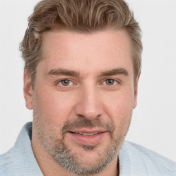 Joyful white adult male with short  brown hair and grey eyes