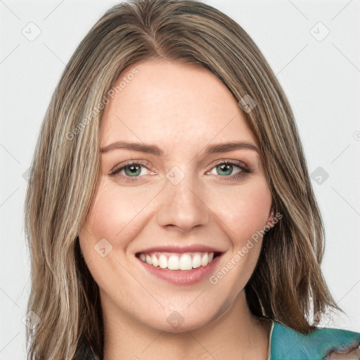 Joyful white young-adult female with long  brown hair and green eyes