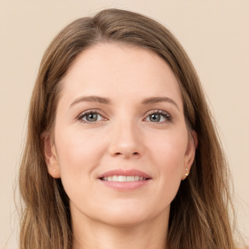 Joyful white young-adult female with long  brown hair and grey eyes