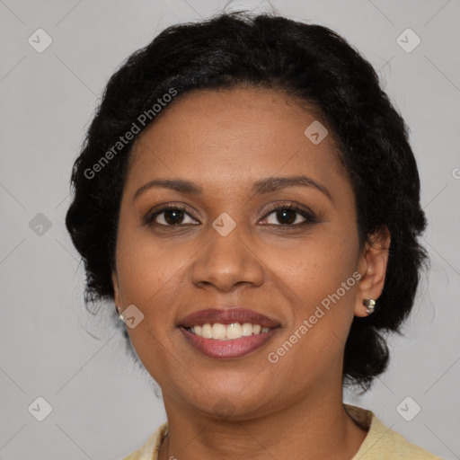 Joyful latino adult female with medium  brown hair and brown eyes