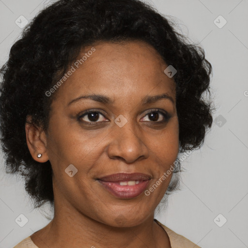 Joyful black adult female with medium  brown hair and brown eyes