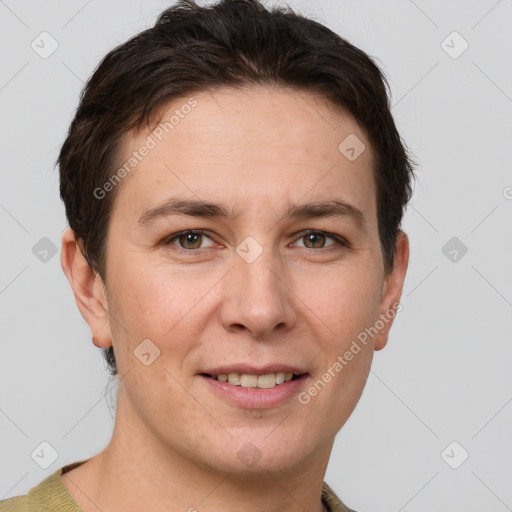 Joyful white adult female with short  brown hair and grey eyes