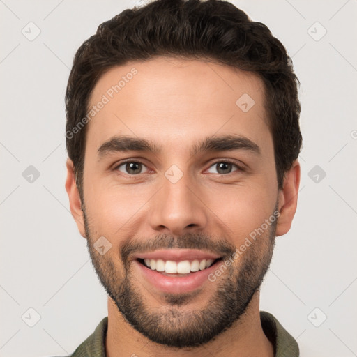 Joyful white young-adult male with short  brown hair and brown eyes