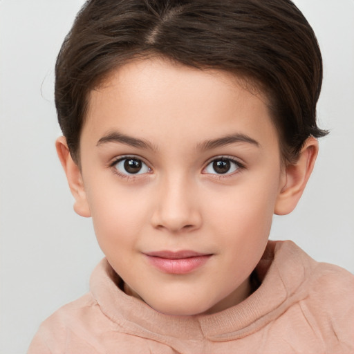 Joyful white child female with short  brown hair and brown eyes