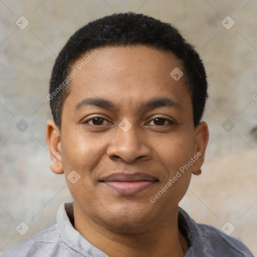 Joyful black young-adult male with short  black hair and brown eyes