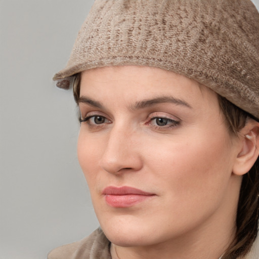 Neutral white young-adult female with short  brown hair and grey eyes