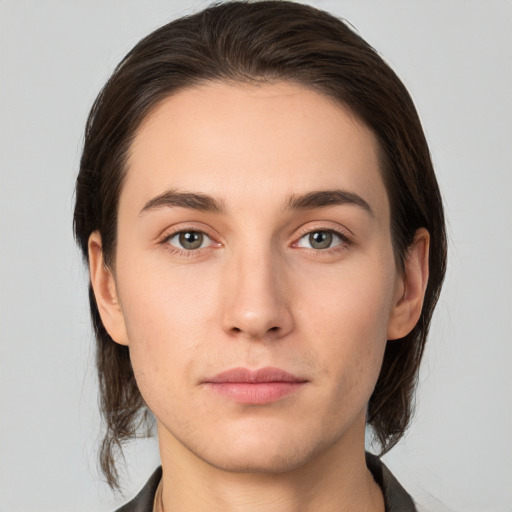 Neutral white young-adult female with medium  brown hair and brown eyes