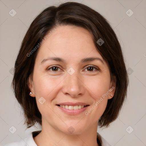 Joyful white adult female with medium  brown hair and brown eyes