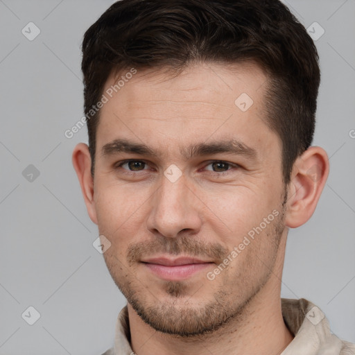 Joyful white young-adult male with short  brown hair and brown eyes