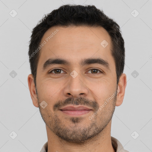 Joyful white young-adult male with short  black hair and brown eyes