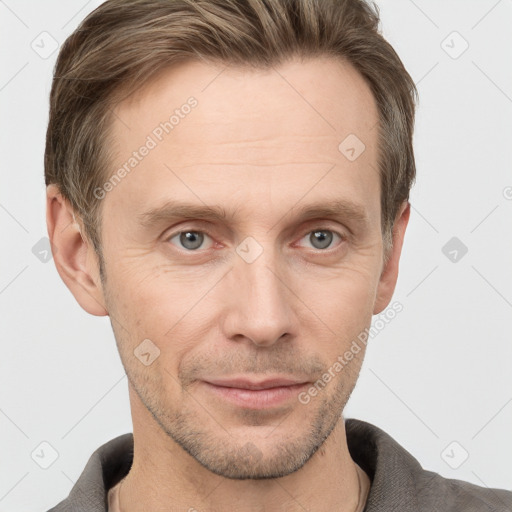 Joyful white adult male with short  brown hair and grey eyes