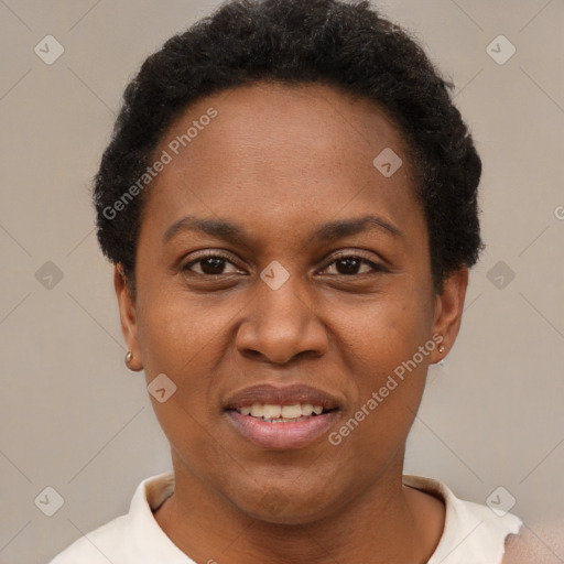 Joyful black adult female with short  brown hair and brown eyes