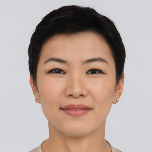 Joyful asian young-adult female with short  black hair and brown eyes
