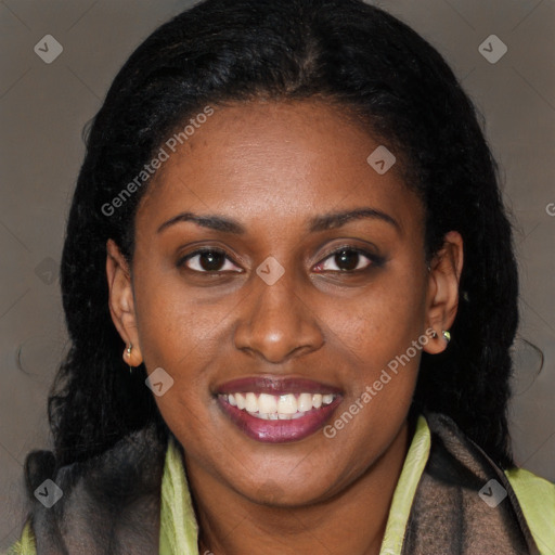 Joyful black young-adult female with long  brown hair and brown eyes