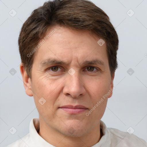 Joyful white adult male with short  brown hair and grey eyes