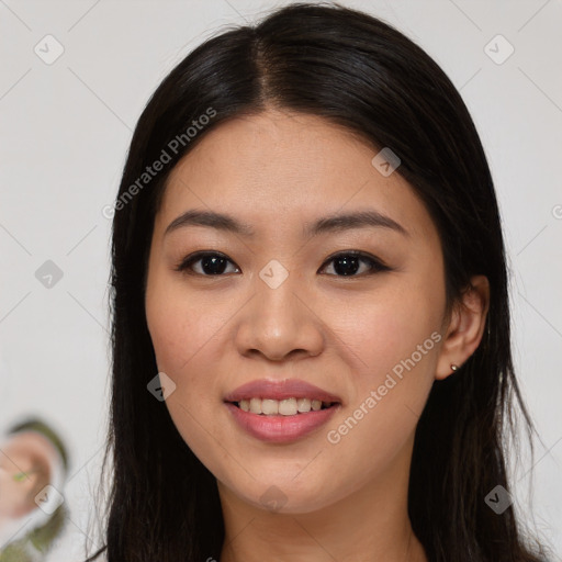 Joyful asian young-adult female with long  brown hair and brown eyes