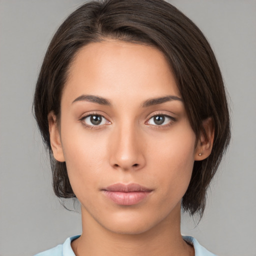 Neutral white young-adult female with medium  brown hair and brown eyes