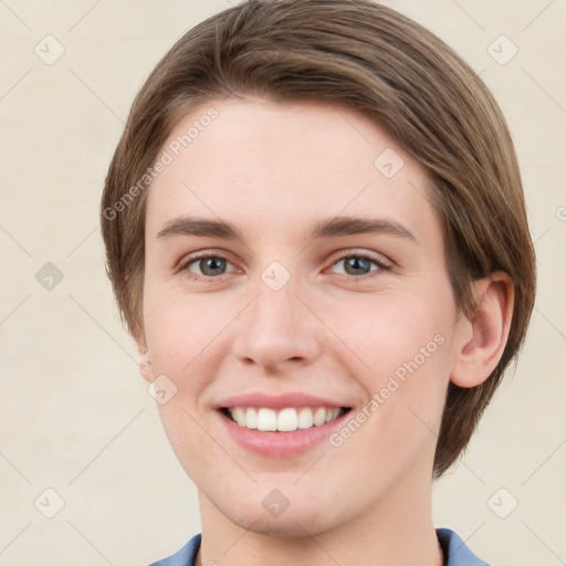 Joyful white young-adult female with short  brown hair and grey eyes