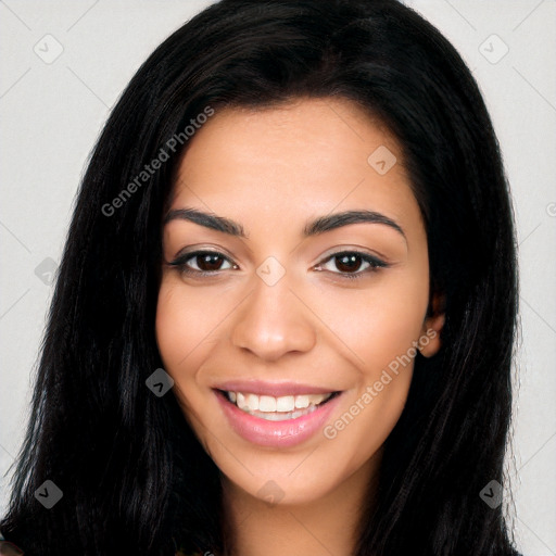 Joyful latino young-adult female with long  black hair and brown eyes