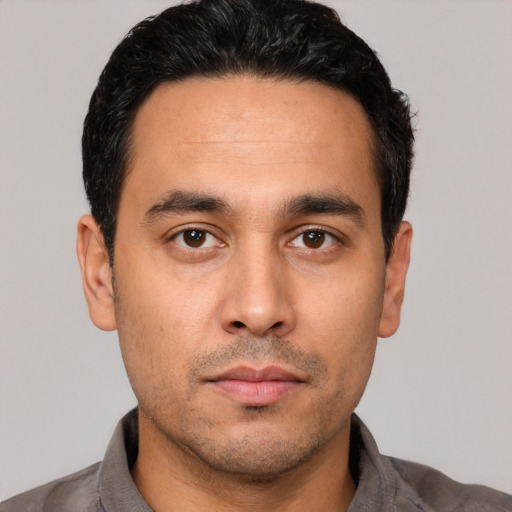 Neutral white young-adult male with short  black hair and brown eyes