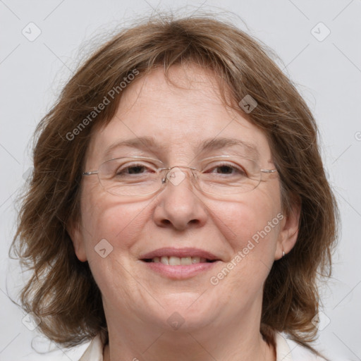 Joyful white adult female with medium  brown hair and blue eyes