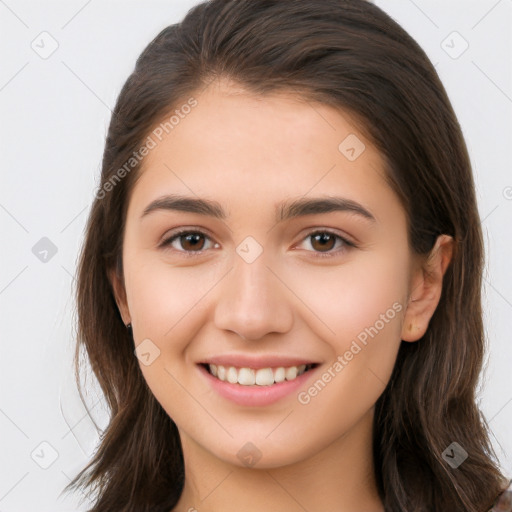 Joyful white young-adult female with long  brown hair and brown eyes