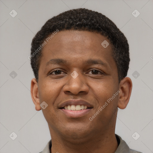 Joyful latino young-adult male with short  brown hair and brown eyes