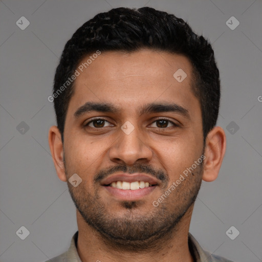 Joyful latino young-adult male with short  black hair and brown eyes