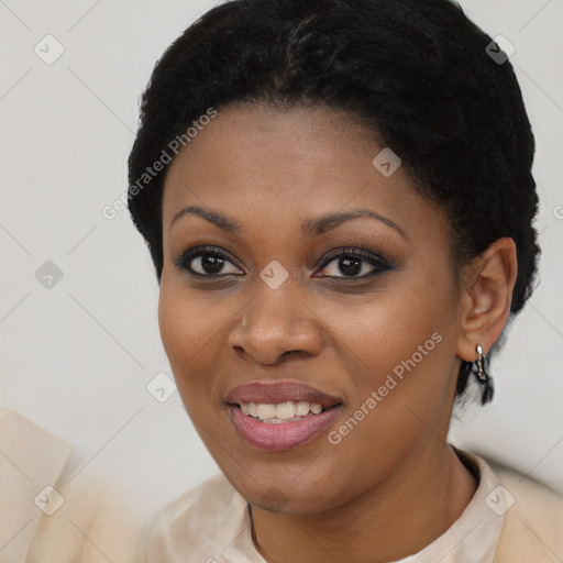 Joyful black young-adult female with short  black hair and brown eyes