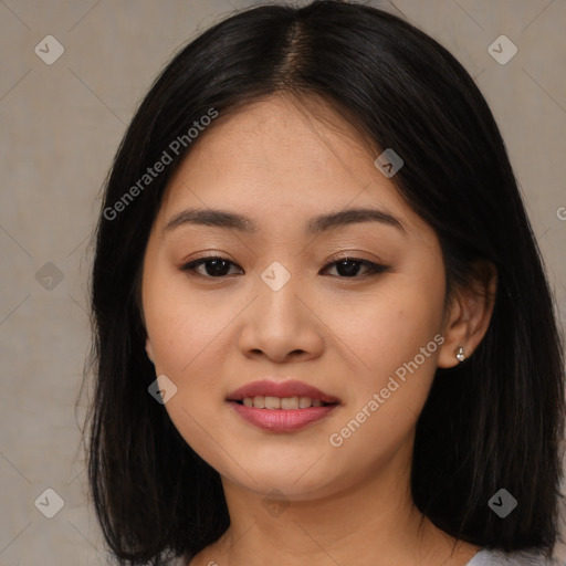 Joyful asian young-adult female with medium  black hair and brown eyes