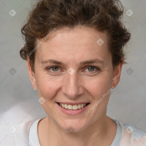 Joyful white adult female with short  brown hair and brown eyes