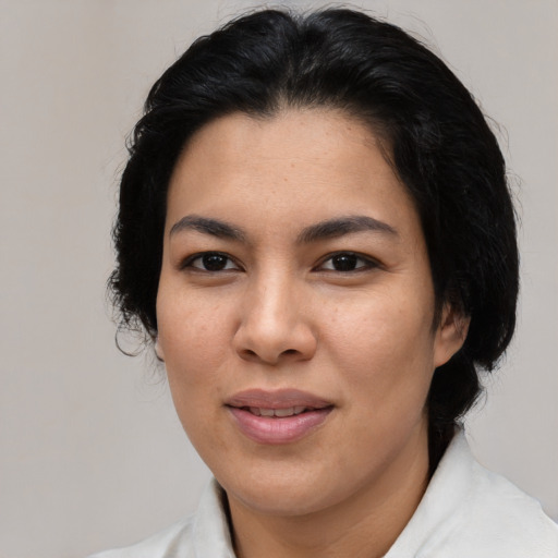 Joyful asian adult female with medium  black hair and brown eyes