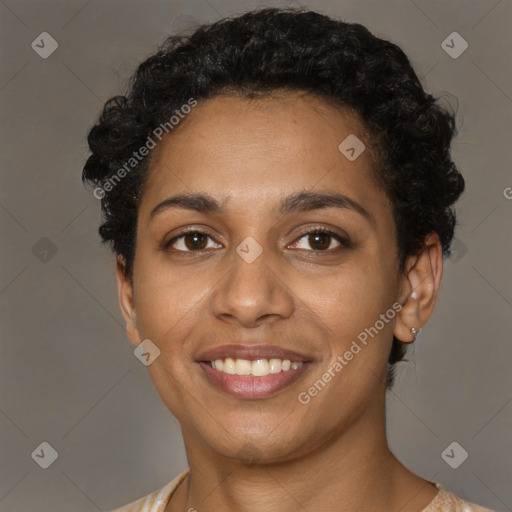 Joyful black young-adult female with short  brown hair and brown eyes