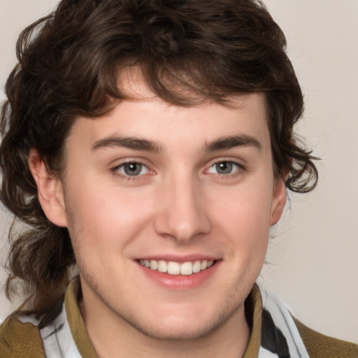 Joyful white young-adult male with medium  brown hair and brown eyes