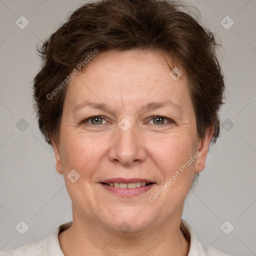 Joyful white adult female with short  brown hair and grey eyes