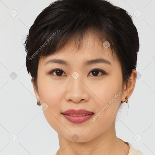 Joyful asian young-adult female with medium  brown hair and brown eyes