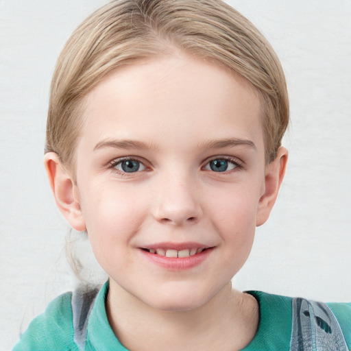 Joyful white child female with short  brown hair and blue eyes