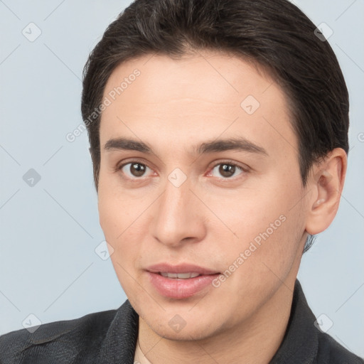 Joyful white young-adult male with short  brown hair and brown eyes