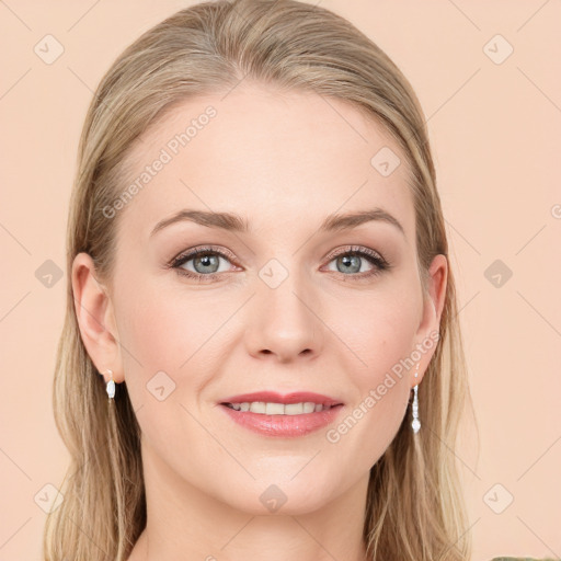 Joyful white young-adult female with long  brown hair and blue eyes