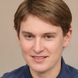 Joyful white adult male with short  brown hair and grey eyes