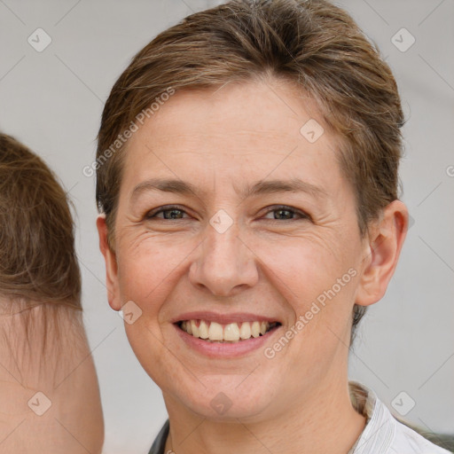 Joyful white adult female with short  brown hair and brown eyes